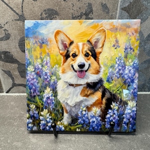 May include: A painting of a corgi dog sitting in a field of bluebonnet flowers. The dog is smiling and has a white and brown coat. The background is a field of yellow and green grass.