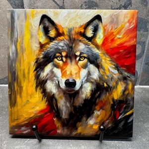 May include: A painting of a wolf with yellow, red, and black fur. The wolf is looking directly at the viewer with a serious expression. The background is a blur of yellow and red.