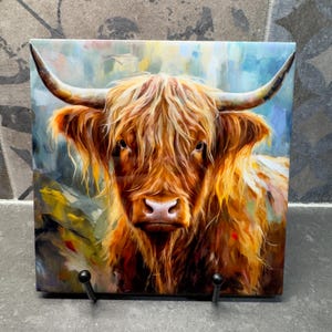 May include: A close-up portrait of a Highland cow with long, shaggy, reddish-brown fur. The cow has a white muzzle and large, dark eyes. The background is a blurred, abstract painting of blue, green, and yellow colours.