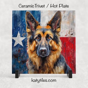 May include: Square ceramic trivet with a German Shepherd dog design and a Texas flag background. The dog has brown and black fur, painted in a watercolor style. The background shows the Texas flag with a white star on a blue field and red stripes.