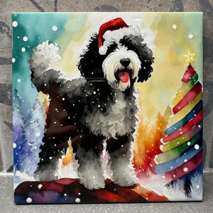 May include: A square tile featuring a watercolor painting of a black and white dog wearing a Santa hat. The dog stands in a snowy scene with a colorful Christmas tree. The background includes a winter forest with falling snow.
