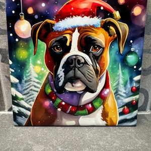 May include: A Boxer dog wearing a red Santa hat and a green and red Christmas collar. The dog is surrounded by a winter wonderland scene with snow, trees, and baubles.