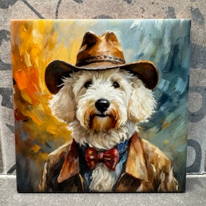 May include: Square canvas art featuring a portrait of a white dog wearing a brown cowboy hat, a brown jacket, and a red bow tie. The background has brushstrokes of yellow, orange, and blue. The dog has a friendly expression.