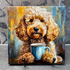 May include: A brown and white poodle dog holding a blue coffee mug with a brown handle. The dog is sitting on a colorful background with a yellow, orange, and blue abstract design.