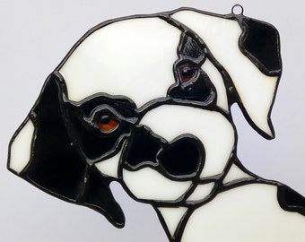 Tiffany stained glass dog sun catcher. Creation of a stained glass panel suspended from a window. Baby dalmatian dog, spotted puppy totem animal