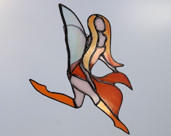 Stained glass suspended from window. Mobile orange fairy in Tiffany stained glass. Original decorative gift for the decoration of a child's bedroom window