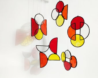 Contemporary wall art. Mobile suspended geometric suncatcher in Tiffany stained glass. Window hanging, minimalist light sensor.