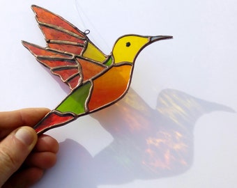 Window hanging stained glass, orange, yellow and red hummingbird. Unusual bird gift, creation of stained glass sun catcher decoration