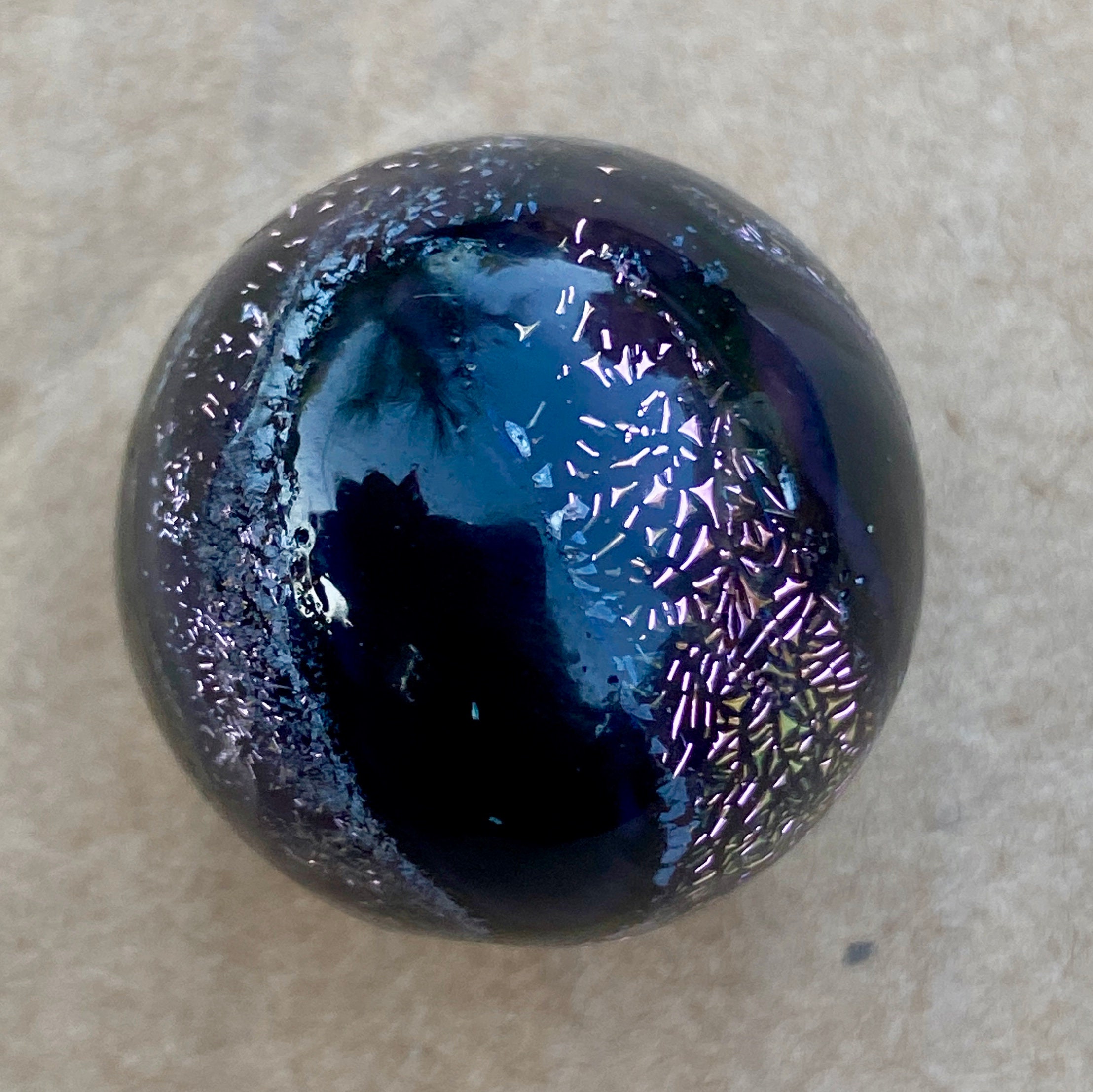 Handmade artisan glass collector's marble with dicro detail.