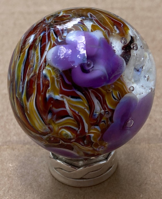 Handmade artisan glass collector's marble head Katrina, with brown hair and purple flowers