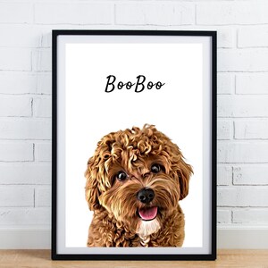 May include: Framed art print featuring a close-up of a brown and tan dog with curly fur and a happy expression. The word "BooBoo" is written above the dog's head in a cursive font. The print is in a black frame.