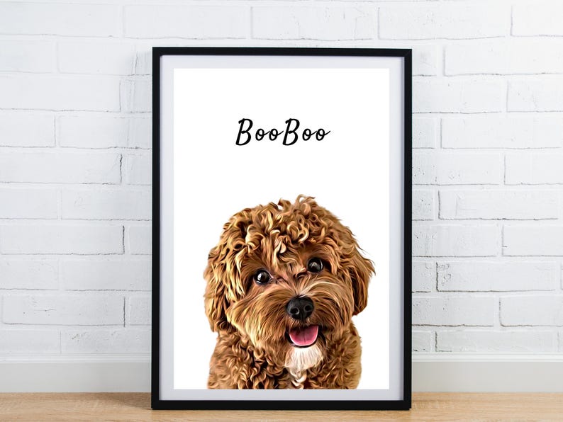 May include: Framed art print featuring a close-up of a brown and tan dog with curly fur and a happy expression. The word "BooBoo" is written above the dog's head in a cursive font. The print is in a black frame.