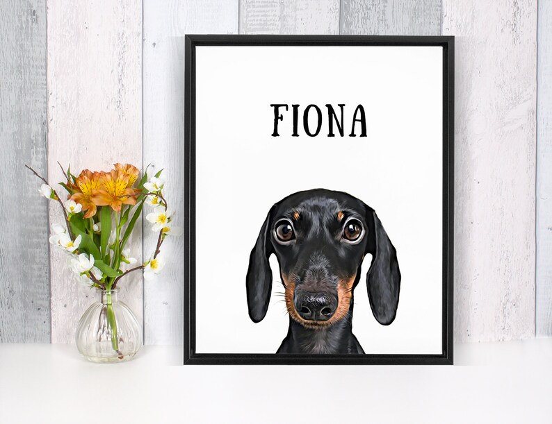 May include: A black and brown dachshund dog with big brown eyes looking directly at the camera. The dog's name, "Fiona", is printed in black text above the dog's head on a white background.