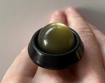 Elliot, a one of a kind adjustable ring, made of two rare old buttons from Norway.