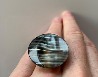Freia, is a one of a kind ring made of a shiny silvery-grey vintage button.