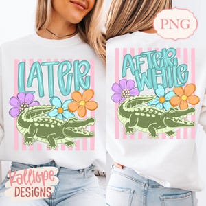 May include: White sweatshirt with a design featuring a green alligator, flowers, and the text "LATER" on the front and "AFTER WHILE" on the back. The design includes pink and white stripes.