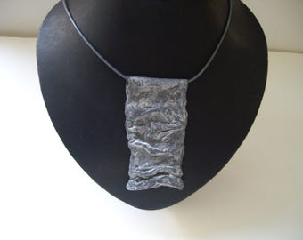 Carry a piece of art with you: unique necklace made of handmade paper.