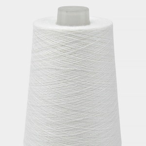 May include: A white cone of yarn, ready to be used for knitting or crocheting.