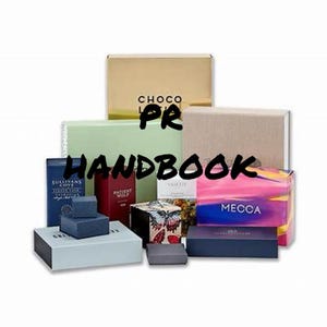 May include: Assortment of colorful boxes with various brand names and designs, including "CHOCO", "SULLIVANS COVE", "PATIENT WOLF", "VALKY", "MECCA", and "PR HANDBOOK".