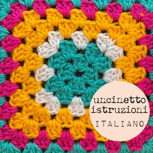 May include: A colorful crochet granny square with a turquoise center, yellow, white, and pink borders. The square has a white circle with black text that reads "uncinetto istruzioni ITALIANO".