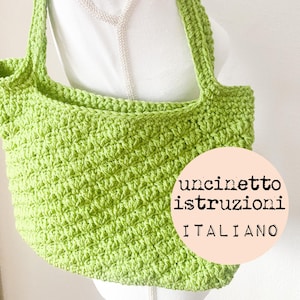 May include: A lime green crocheted tote bag with a white background and the text "uncinetto istruzioni ITALIANO".