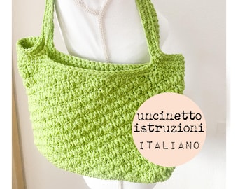 May include: A lime green crocheted tote bag with a white background and the text "uncinetto istruzioni ITALIANO".