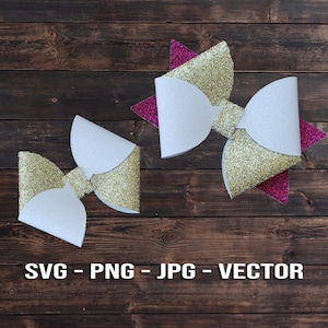 Puede incluir: Dos lazos de purpurina dorada con centros blancos. El lazo de la derecha tiene un acento de purpurina rosa. Los lazos están sobre un fondo de madera marrón.