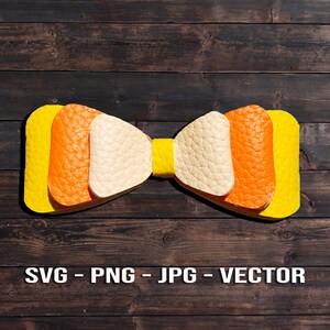 May include: A yellow, orange, and white bow tie made of leather. The bow tie is on a dark brown wooden background.