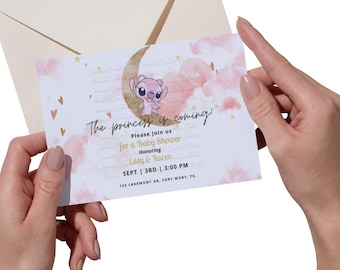 May include: A baby shower invitation with a pink and gold color scheme. The invitation features a cartoon character on a crescent moon with clouds and stars in the background. The text on the invitation reads "The princess is coming!" and includes the date, time, and location of the event.