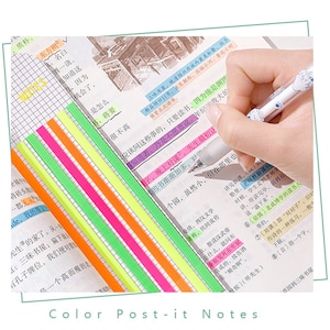 May include: A set of colorful sticky notes in various bright colors, including yellow, green, pink, orange, and blue. The notes are arranged in a stack and are being used to highlight text in a notebook.