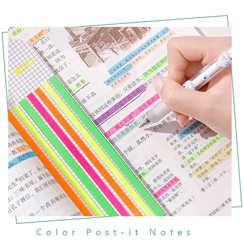 May include: A set of colorful sticky notes in various bright colors, including yellow, green, pink, orange, and blue. The notes are arranged in a stack and are being used to highlight text in a notebook.