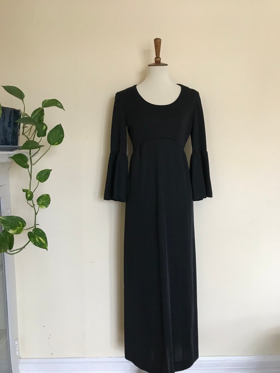 Empire waisted black evening dress with bell sleev