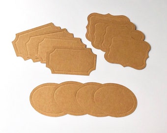 May include: A set of brown paper gift tags with scalloped edges. The tags are blank and ready to be written on. There are also three round brown paper tags.