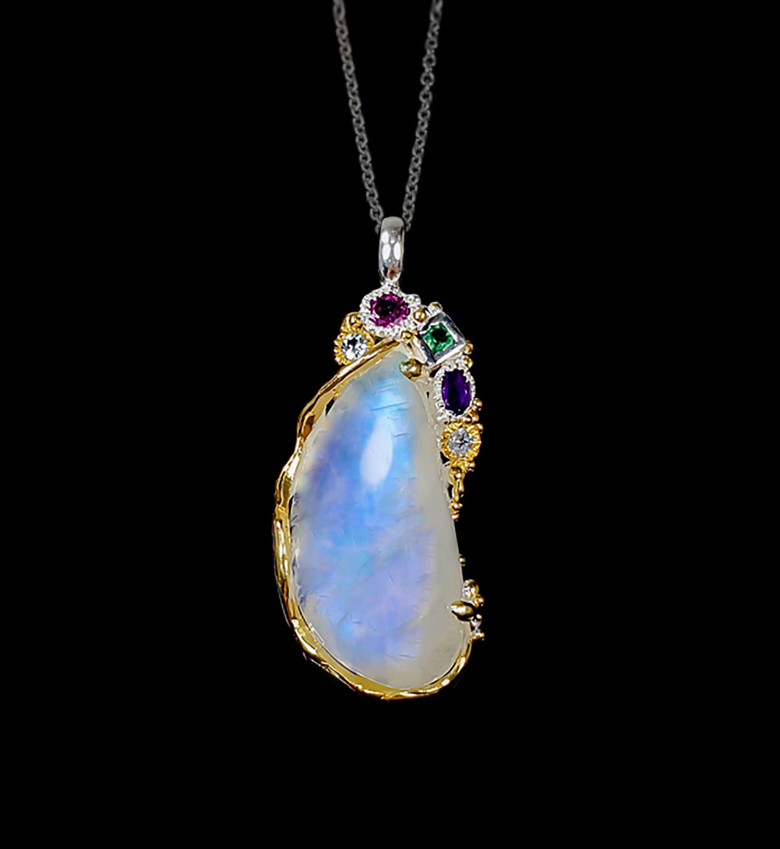 Large rainbow moonstone pendant with amethyst, rhodolite, and onyx