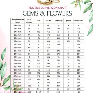 May include: A ring size conversion chart with a floral design, featuring a gold ring and a table showing ring diameters in mm, UK sizes, and corresponding USA, French, German, Japanese, and Swiss sizes.