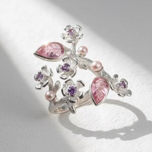 Pink tourmaline blossom ring inspired by sakura flowers, handcrafted in sterling silver.