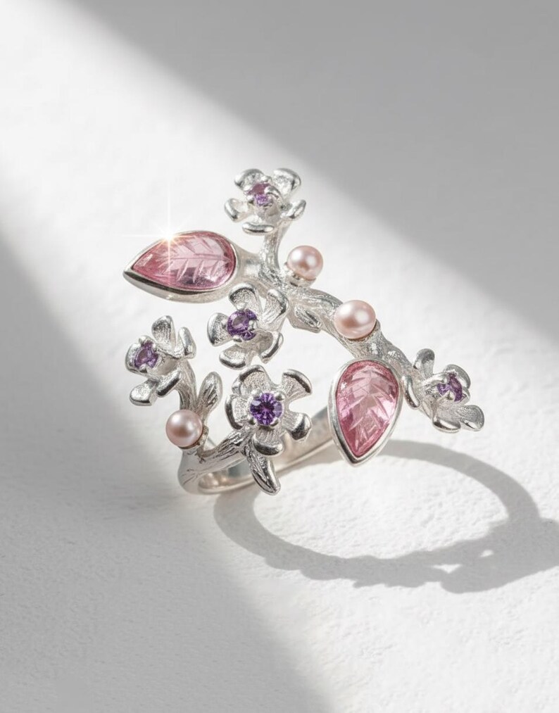 Pink tourmaline blossom ring inspired by sakura flowers, handcrafted in sterling silver.