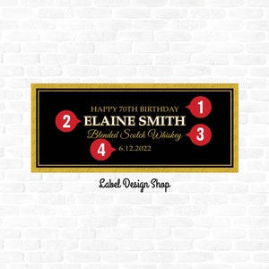 May include: A black and gold label with the text "HAPPY 70TH BIRTHDAY" and "ELAINE SMITH Blended Scotch Whiskey 6.12.2022". The label has a gold border and is set against a white brick wall. The text "Label Design Shop" is at the bottom.