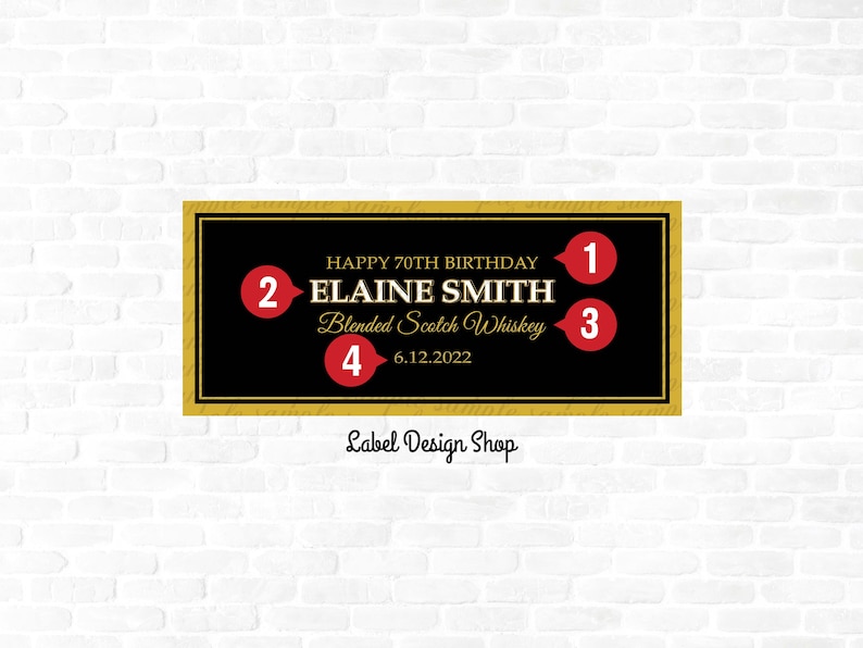 May include: A black and gold label with the text "HAPPY 70TH BIRTHDAY" and "ELAINE SMITH Blended Scotch Whiskey 6.12.2022". The label has a gold border and is set against a white brick wall. The text "Label Design Shop" is at the bottom.