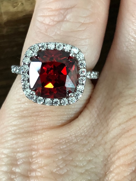 A 3CT Cushion Cut Lab Garnet Halo Ring