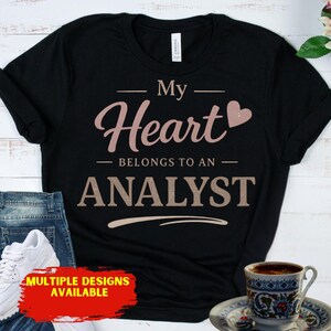 May include: A set of three ceramic mugs with a speckled, matte finish. The mugs are in shades of cream, light gray, and dark gray. Each mug has a simple, minimalist design, perfect for coffee or tea.