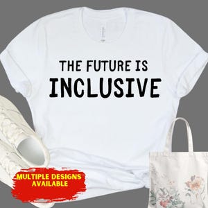May include: White t-shirt with the text "THE FUTURE IS INCLUSIVE" in black block letters. A pair of white sneakers and a floral tote bag are also visible. A red banner at the bottom reads "MULTIPLE DESIGNS AVAILABLE."