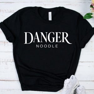 DANGER NOODLE SHIRT - Funny Pet Snake Lover Tee - Reptile Owner Apparel - Herpetology Gift Top - Cute Serpent Graphic Outfit - Ball Python