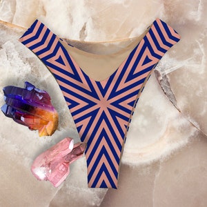 May include: A pair of pink and navy blue underwear with a geometric pattern. The underwear is made of a soft, stretchy fabric and has a high-cut leg.