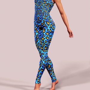May include: A blue and yellow leopard print jumpsuit with a sleeveless design.