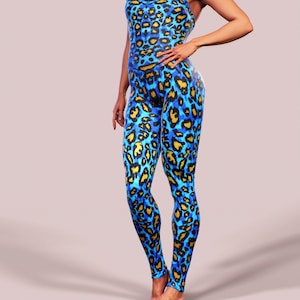 May include: A blue and gold leopard print jumpsuit with a racerback style.