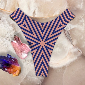 May include: A pair of underwear with a geometric pattern in shades of blue and brown. The underwear is made of a soft, stretchy fabric and has a low-rise cut.