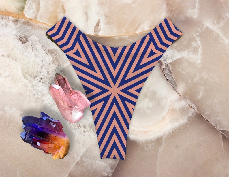 May include: A pair of underwear with a geometric pattern in shades of blue and brown. The underwear is made of a soft, stretchy fabric and has a low-rise cut.