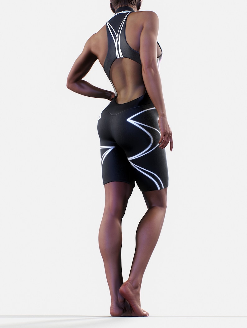 May include: Black and white athletic one-piece suit with a cutout back and white geometric design.