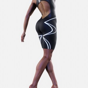 May include: A black one-piece athletic suit with white geometric lines. The suit has a cutout back and a high neckline.